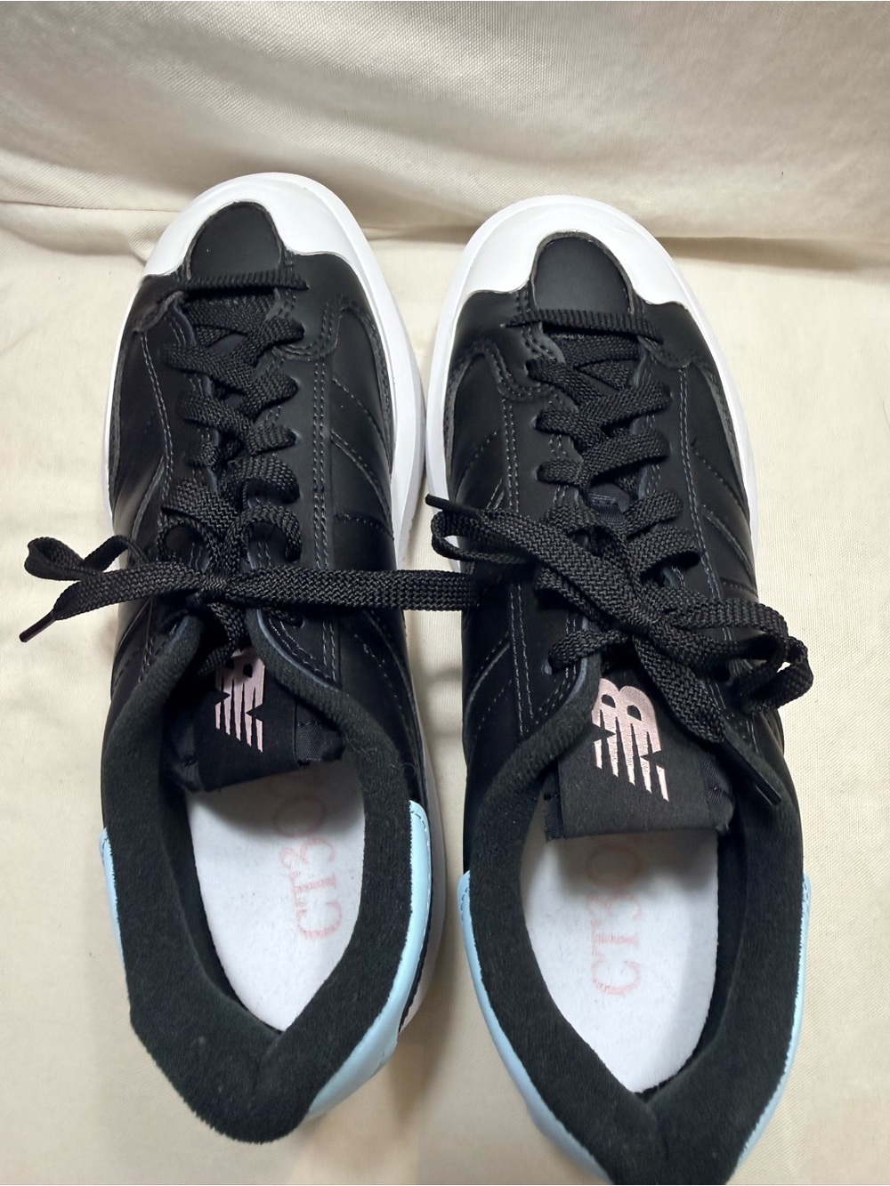 New Balance - Black and White Women's Leather Sneakers with Light Blue Accent